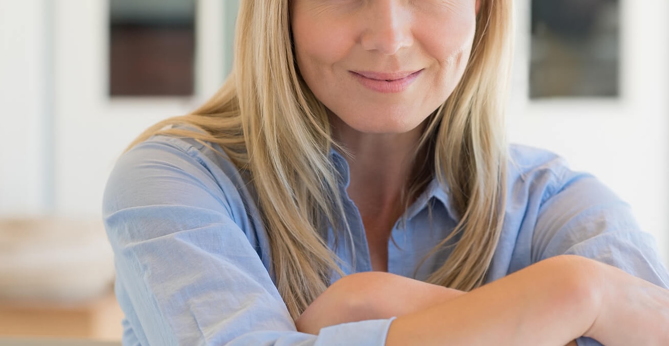 happy mature woman | emdr therapy in raleigh, nc | emdr therapist in raleigh, nc | emdr therapy for childhood trauma | emdr trauma therapy | 27617 | 27596 | 27616 Image of a smiling mature woman. Unable to heal from childhood trauma? Discover how EMDR therapy in Raleigh, NC can help you begin to cope and heal.
